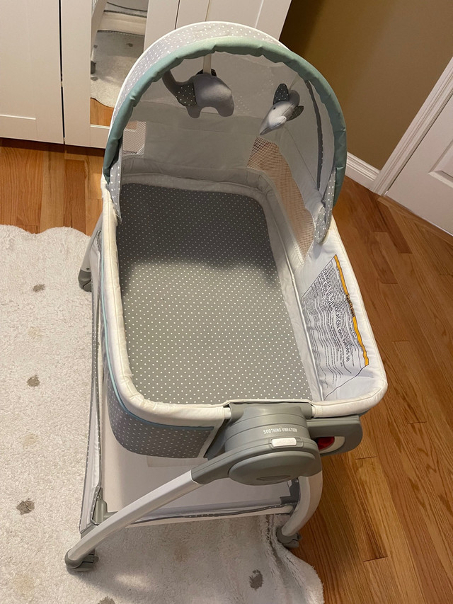 Graco baby bassinet with changing station in Cribs in Edmonton