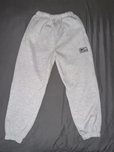 Lightly worn Stüssy x Nike fleece sweatpants in size Medium. Features a comfortable relaxed fit with...