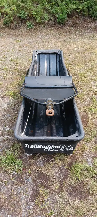 Trail boggan skimmer for pulling behind snow mobile with built on snow deflector and cover. Very goo...