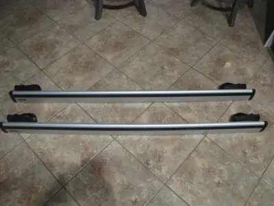 Almost new..Thule roof racks for Jeep Cherokee. 220 lb Capacity. Adjustable. All lockable c/w 4 keys...