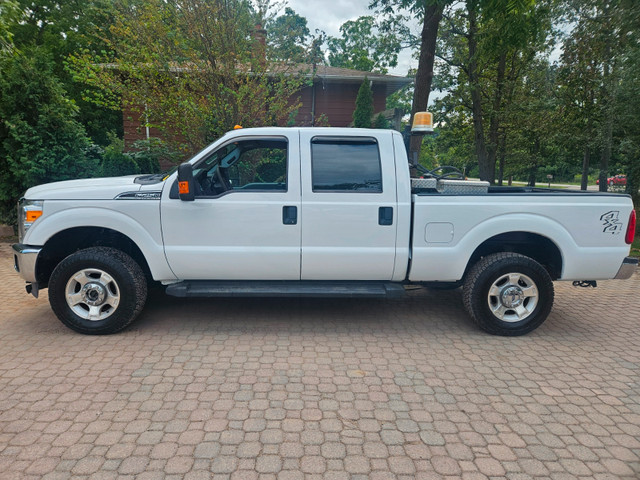 2015 Ford F250 Crew Cab Low kilm, Western plow in Cars & Trucks in Hamilton
