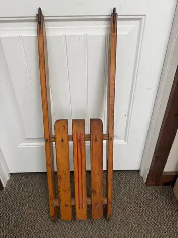 Charming 36” antique wooden sleigh with red painted detail and classic curved runners. Ideal as a ho...