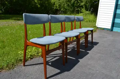 Selling a nice set of 1960's teak dining chairs. The chairs have vintage blue upholstery along with...