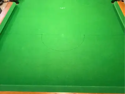 Solid pool table with slate top in good condition. Includes regular balls and snooker balls, racks,...
