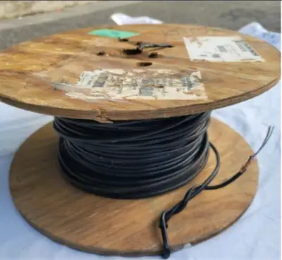 A reel with 180M (540 feet) of two pair (4-wire) 22 AWG communication / telephone burial wire. Will...