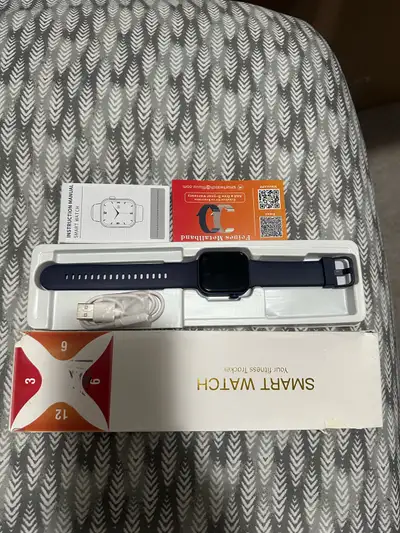 This Fituuu smart watch is in like-new condition, featuring a sleek navy blue band and a digital fit...