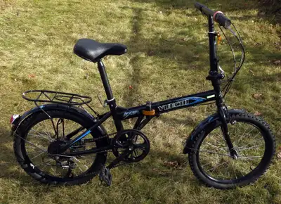 Folding Bike: 7 speed with fenders, kick stand, rear rack. Will trade for older mountain bike with l...