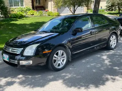 Ford Fusion SEL 3.0 awd. Sunroof, park assist, Bluetooth audio. Car runs good. Tires are one season...