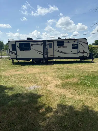 2015 Tracer Ultra Light 31 foot. Weighs just 7140 pounds half ton towable. New tires two years ago ....