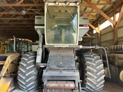 Gleaner M3 for sale with corn and soybean/wheat flex head with air reel. Always stored inside, one o...