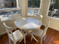 White ikea round to oval table and 6 matching chairs