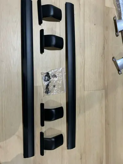 I am selling a new set of black roof rack side rails. They measure approximately 35 inches and 37 in...