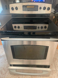 GE stainless steel and black Stove