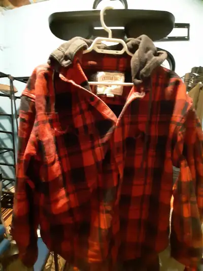 This is an American Eagle red and black plaid flannel shirt with a grey hood, in size XL. It's in go...