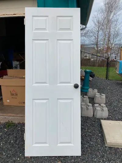 Small interior door. 29 inches wide, 79 inches high. Hinges and doorknob. No frame.