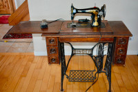 Antique Singer sewing machine with cabinet