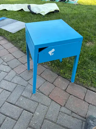 This is a blue IKEA Selje nightstand made of metal, perfect for adding a pop of colour to your bedro...