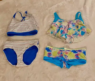 Bathing suits : reversible striped $20 multicoloured $25 Gymnastic suits : $25 each Swim shorts $15...