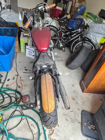 This customized Honda Shadow VLX600 Bobber features a distinctive solo seat, chopped rear fender wit...
