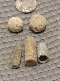 Two musket balls and three bullets from Ireland