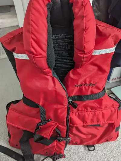 Light new adult life jacket only been used once in very good shape. It is XL tall. The name is life...