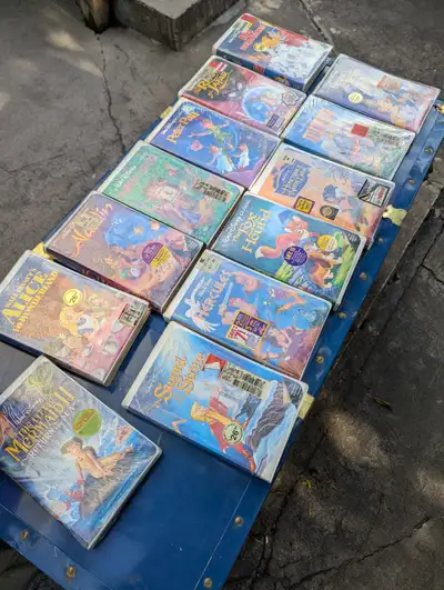 See photos for titles. All VHS are sealed. Cash only. Pick up near St Claire and Oakwood.