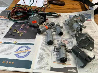 Six pin trailer harnesses. Should be enough to do three trailers and three tow vehicles give or take...