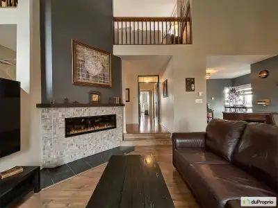 Stunning 1,397-square-foot penthouse with a cathedral ceiling opening onto a mezzanine, offering abu...