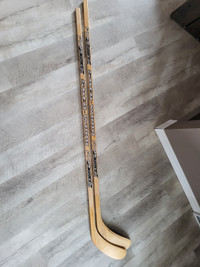 2 right handed wood hockey sticks NEW