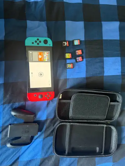 Nintendo switch with games and accessories , View more