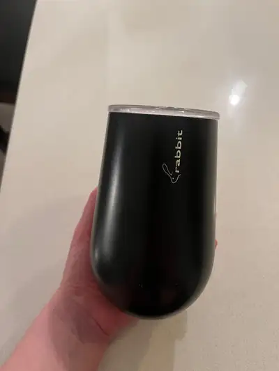 Sip your wine in style with this Rabbit wine tumbler! It's a sleek, black, stainless steel wine glas...