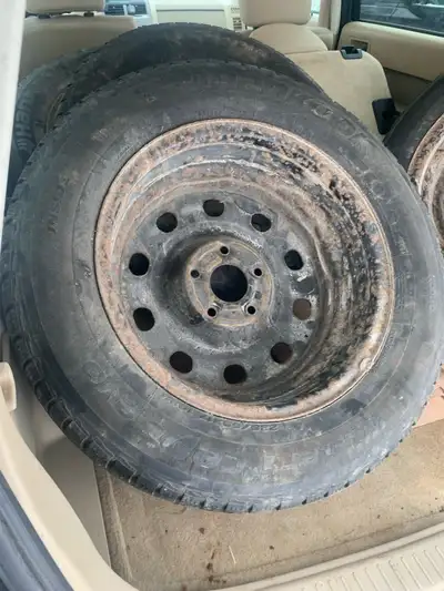 Winter tires on rims have tread for 2 winter seasons. Set of 4.