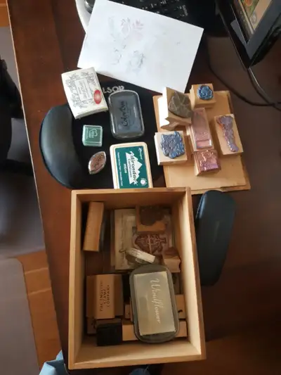Assorted stamps and ink pads. Mostly floral/botanical.