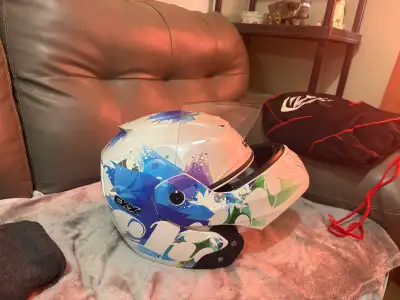 This is a CKX motorcycle helmet designed for women, perfect for riders looking for style and safety...