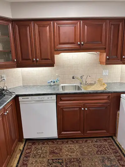 Solid custom made maple kitchen cabinets and white range., View more