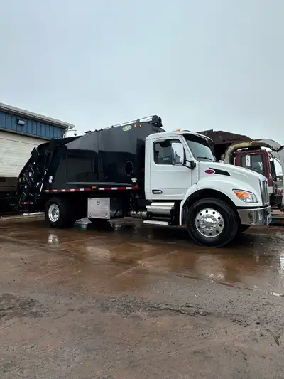 Brand new Peterbilt 537 with 20 yard New-Way cobra rear load garbage packer. Comes with Reeving cyli...