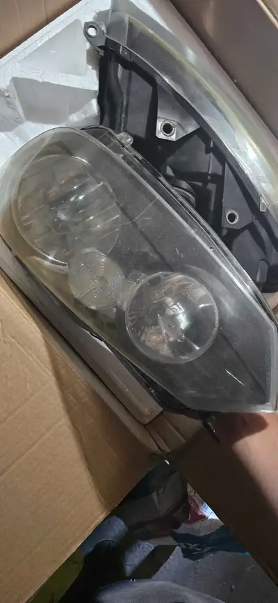 These Volkswagen Golf MK4 headlights are original components that have seen some road time and show...