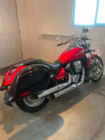 Comes with bike cover, battery tender, oil filter wrench and funnel, removable hard bags, excellent...