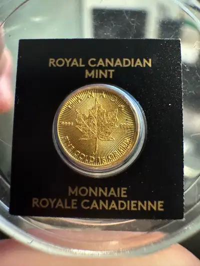 This is a 1 gram coin of 9999 fine gold from the Royal Canadian Mint. It features a maple leaf desig...