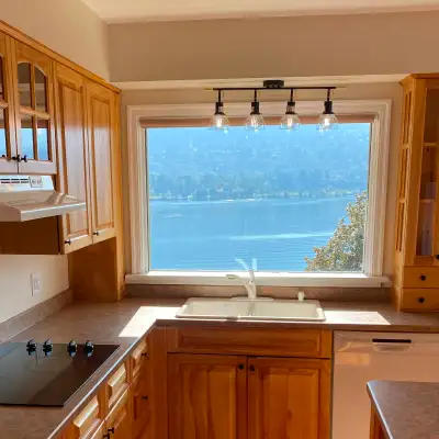 Experience waterfront living in a beautiful park-like setting just minutes from Nelson. This renovat...