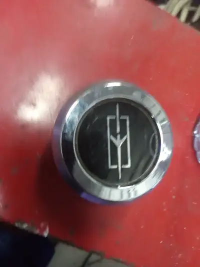 78-81 olds cutlass center caps.. set of 4 new old stock .. $300 with free shipping