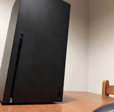 Carbon black console works perfectly, ships with all the correct cables and working controller.
