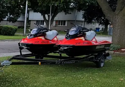 Selling a pair of matching seadoos with the trailer. Trailer is a double ez loader. Seadoos both hav...