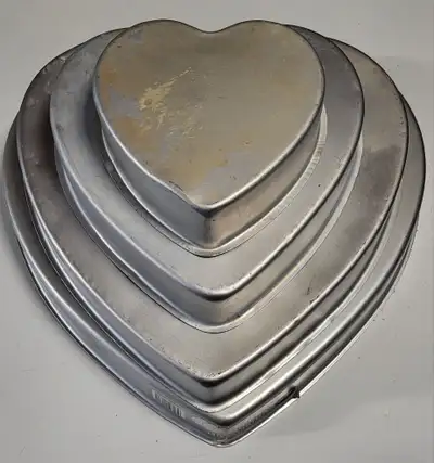 2 sets of Wilton cake pans and 2 cake stands, View more