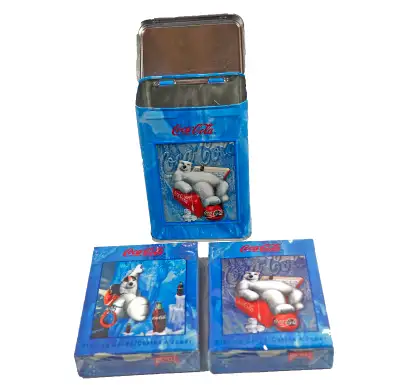 Experience the magic of Coca-Cola with these double decks of playing cards featuring lovable polar b...
