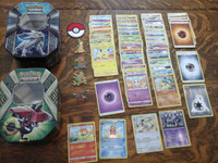 A Collection of Pokémon  Cards (253), Pins and Tins