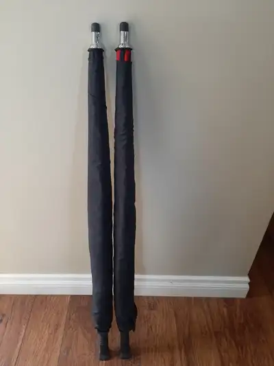 2 umbrellas, one is red and the other is black. Like new condition, barely used. They are 38" long....