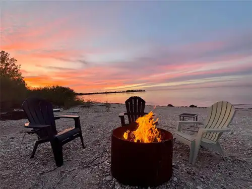 Wake up to peaceful water views and end your days under spectacular prairie sunsets. This premium wa...
