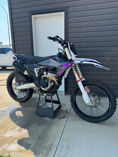 Mint condition, with only 7 hours and all new custom plastic decal kit and seat cover! Also has all...