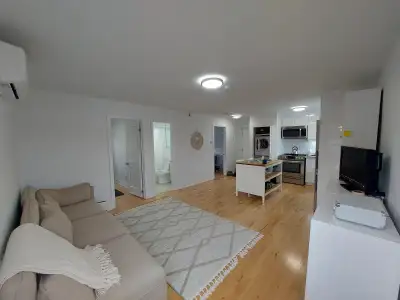 Modern kitchens featuring stainless steel appliances: fridge/freezer, dishwasher, range, and built-i...